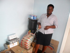 A member of the Eston saving club showing some of the groceries.
