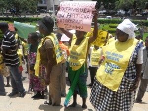Vendors wave placards at Town House.