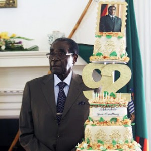 The man and his cake ... President Robert Mugabe at State House on Monday