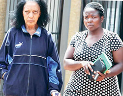 Court arrival ... Brenda Avril May with a police detective (Picture credit Zimpapers)