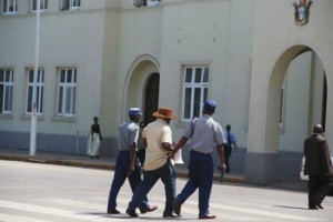 Taken away ... Police arresting Silvanos Mudzvova (Picture by Shepered Tozvireva and NewsDay)