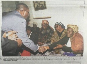 The helping hand ... Mugabe greeting mourners Tuesday