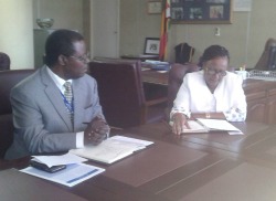 Negotiation table ... UNHCR Rep, Robert Tibagwa and Mupfumira