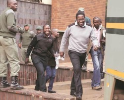 Walking out Rotten Row courts ... Sunday Mail Editor Mabasa Sasa and his colleagues
