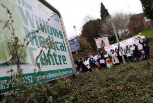 IN PICTURE: Protesters pictured outside The Willows Medical Centre in Church Street, Carlton. STORY: LEAD: Zimbabweans protest at looting British GP Zimbabwean exiles in the UK are to protest outside a clinic in Nottingham run by a Zimbabwean immigrant doctor who has seized one of the last white-owned farms in Zimbabwe. Dr Sylvester Nyatsuro, a British citizen, claims that the Mugabe regime has told him he can have thefarm although he has been resident in England for more than 15 years. His wife, Veronica is related to Mugabe’s wife Grace. The farm has been besieged by hired thugs for months but last Friday armed police forced their way in and took away the owner Zimbabwean-born Phillip Rankin who was about to harvest a crop worth up to £240,000. The demonstration is organized by the Zimbabwe Vigil which has been protesting outside the Zimbabwe Embassy in London every Saturday since October 2002 in support of human rights in Zimbabwe. Vigil Co-ordinator Fungayi Mabhunu said: ‘The Nyatsuros have grown rich on the NHS. What do they think they are doing depriving a productive farmer of his home and his livelihood just because he is white? Zimbabwe needs farmers not hypocritical absentee landlords. Nottingham must say that now that the Nyatsuros have the farm they must go and work the land there. Instead it will be a glorified holiday home while Zimbabwe starves.’ The Zimbabwe Vigil is running the following petition to David Cameron: Zimbabwean exiles in the United Kingdom and sympathisers are appalled by the behaviour of Dr Sylvester Nyatsuro and his wife Veronica who run theWillows Medical Centre in Nottingham. Dr Nyatsuro is a British citizen, long resident in this country, yet he has illegally seized a farm in Zimbabwe owned by a white Zimbabwean farmer, Mr Phillip Rankin, who bought it with the approval of the Mugabe government. Dr Nyatsuro and his wife are reported to be connected to Grace Mugabe. We are puzzled why a British doctor should want a far