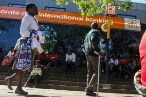 Cash crisis ... Scores of people wait outside POSB bank in Harare 