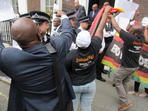Police protect Chinamasa and friends from Vigil protesters