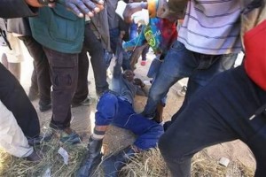 Residents beating up a policeman