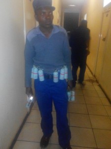 A policeman wearing a teargas belt during the demo in Harare yesterday.