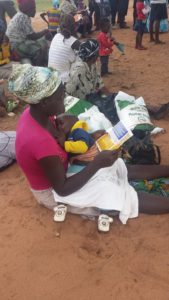 A teenage mother in Nkayi waiting to be given relief food by ACCZ officials. 