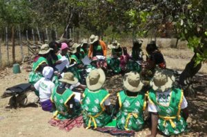 Members of WSSR going through the training manual again in Gutu before embarking on the door to door campaigns.