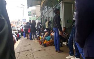 Citizens seen queue for their hard earned money at banks for long hours.