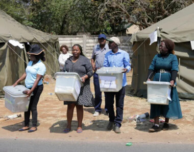  Zimbabwe Electoral Commission (ZEC) officials and polling agents carry ballot boxes of presidential, parliamentary and councilors elections from a polling station to a command center in Harare, Zimbabwe, 24 August 2023. President Emmerson Mnangagwa issued a decree late on 23 August to extend voting for another day at some polling centers, while other polling stations began the counting of ballots of the 2023 Zimbabwean general election to elect a president, members of parliament and councilors. EPA-EFE/AARON UFUMELI