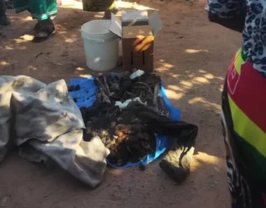 Police accused after handcuffed body found buried in pit latrine